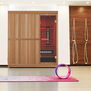 Finnmark FD-5 Trinity XL Infrared & Steam Sauna Combo situated on a yoga mat in front of a wooden cabinet.
