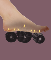 Foot using the Daiwa Hubble Massage Chair's foot roller, highlighting its advanced massage features for optimal relaxation and therapeutic benefits.