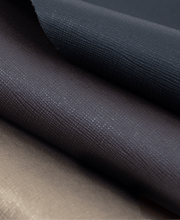 Close-up of the Saffiano PU leather upholstery on the Daiwa Hubble Massage Chair, highlighting the high-quality fabric and intricate texture details.