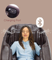 A woman relaxes in a Daiwa Majesty Massage Chair, eyes closed, experiencing whole-body massage and wellness therapies.