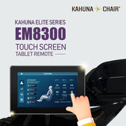 A hand using the touch screen remote of a Kahuna EM 8300 Black Massage Chair.