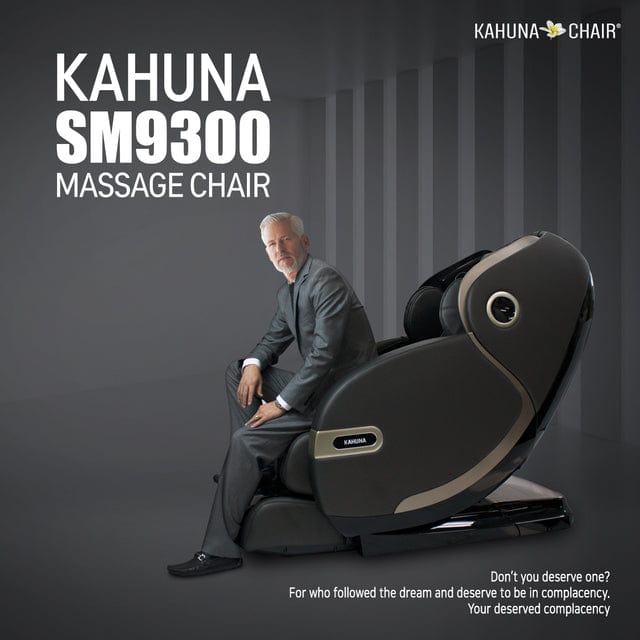 A man sits in the Kahuna SM-9300 Massage Chair, showcasing its advanced features for a personalized and luxurious massage experience.