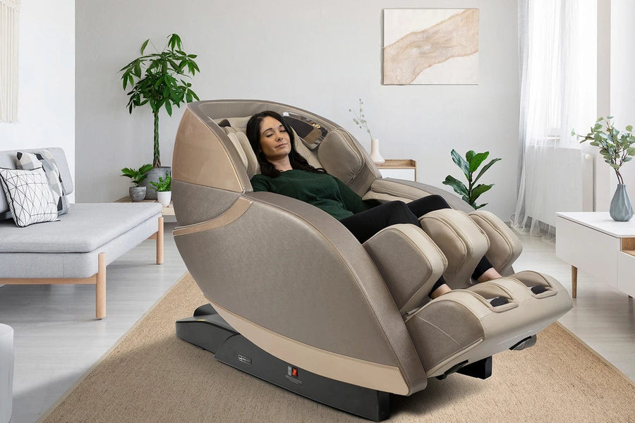 A woman lying in the Kyota Kansha M878 Massage Chair, designed for total body wellness with 4D back mechanism, calf kneading, and foot rollers.