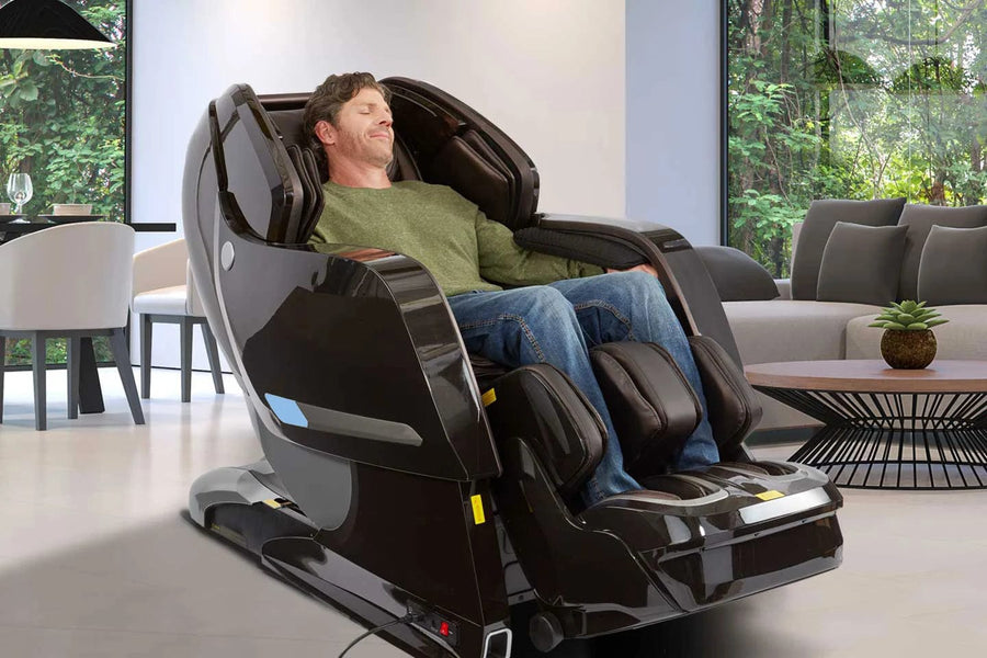 A man sleeping in a Kyota Yosei M868 4D massage chair, showcasing its advanced features for ultimate comfort and relaxation.