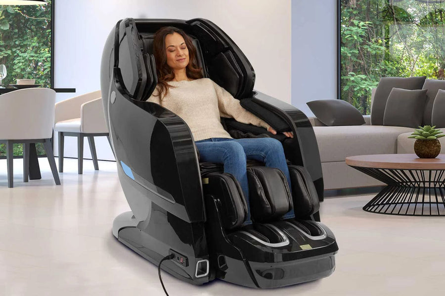 A woman enjoying the Kyota Yosei M868 4D Massage Chair, featuring advanced massage technology and customizable comfort for ultimate relaxation.