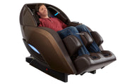 A man sleeping in the Kyota Yutaka M898 Massage Chair, showcasing its therapeutic and immersive capabilities.