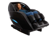 A woman relaxing in the Kyota Yutaka M898 Massage Chair, showcasing its full-body therapeutic features and advanced technology.