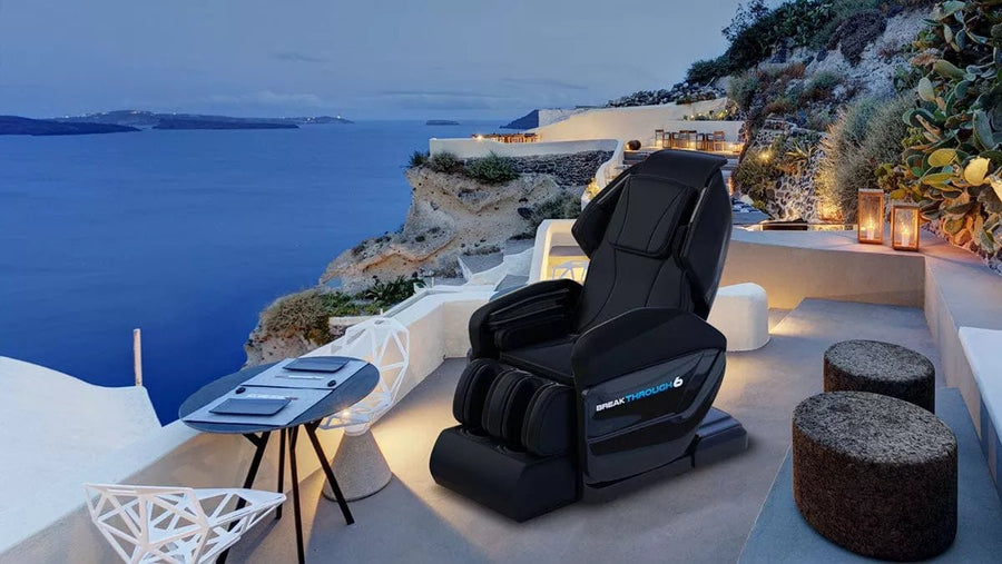 Medical Breakthrough 6 Plus massage chair on a balcony overlooking the ocean, designed to improve posture, reduce pain, and promote sleep.