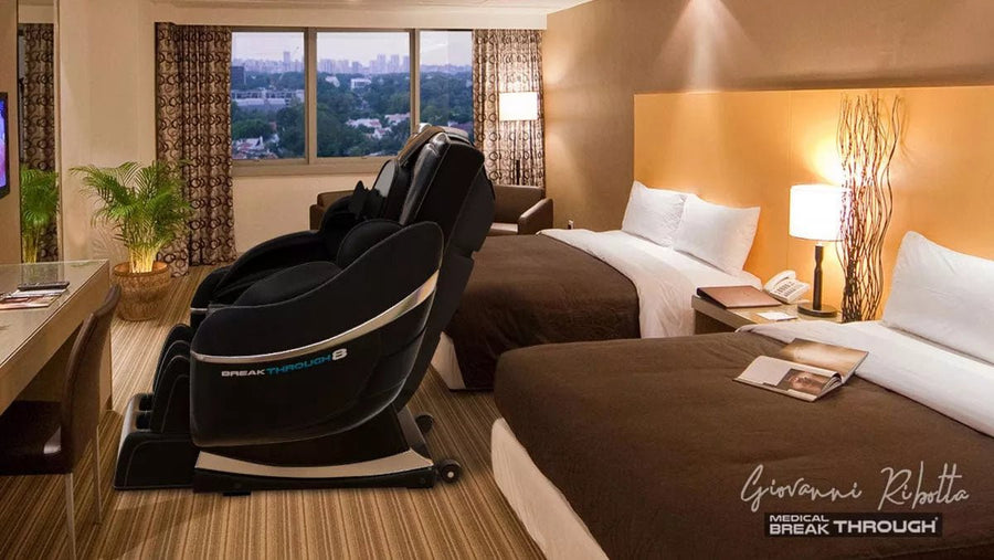 Medical Breakthrough 8 massage chair in a hotel room, featuring advanced posture correction, full body reflexology, and zero gravity sleep system.