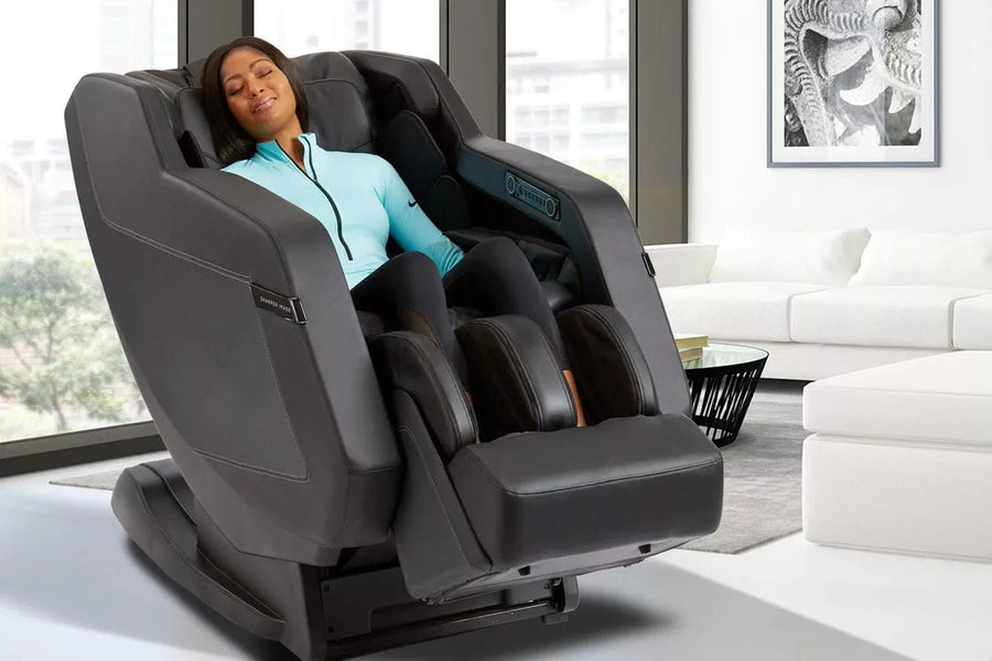 A woman relaxing in the Sharper Image Relieve 3D Massage Chair, designed for deep tissue relief with advanced massage technology.